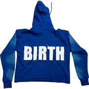 A picture of EXCLUSIVE Blue Crop Hoodie with a design that shows 'BIRTH' on the back