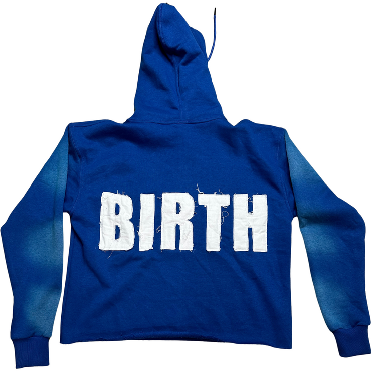 A picture of EXCLUSIVE Blue Crop Hoodie with a design that shows &