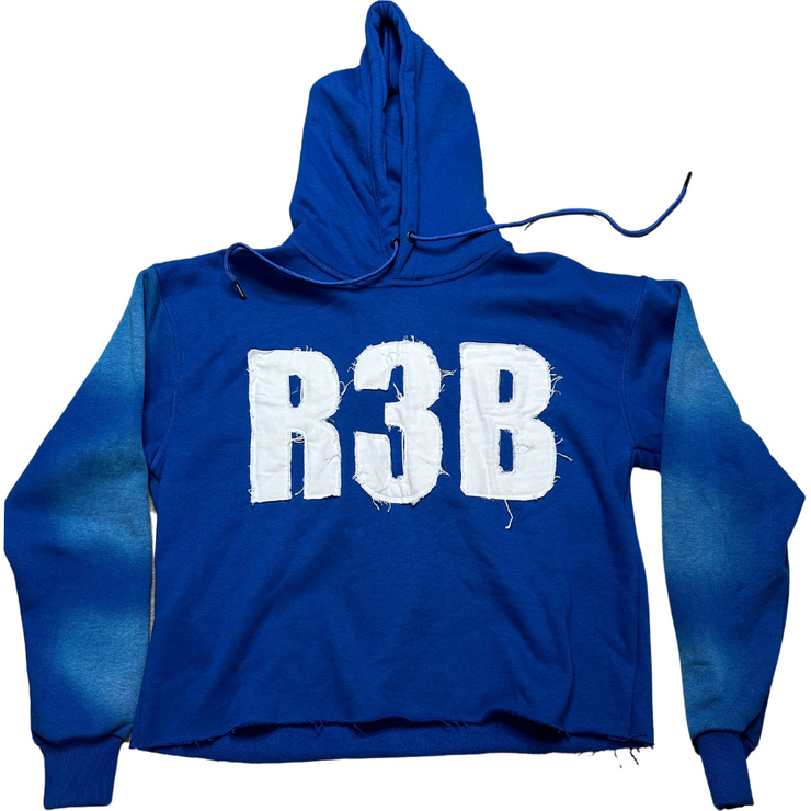 A picture of EXCLUSIVE  Blue Crop Hoodie with a design that shows &
