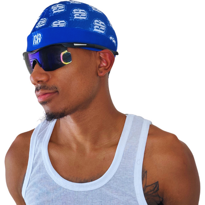 Man wearing a blue skull cap with a design that shows the R3birth clothing logo