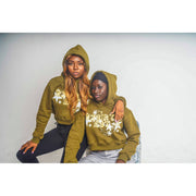 Two girls wearing olive green hoodies with a design that shows "R3BIRTH EST '23" in a decorative style