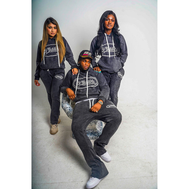 three people wearing black acid washed hoodie with a design that shows the R3Birth logo