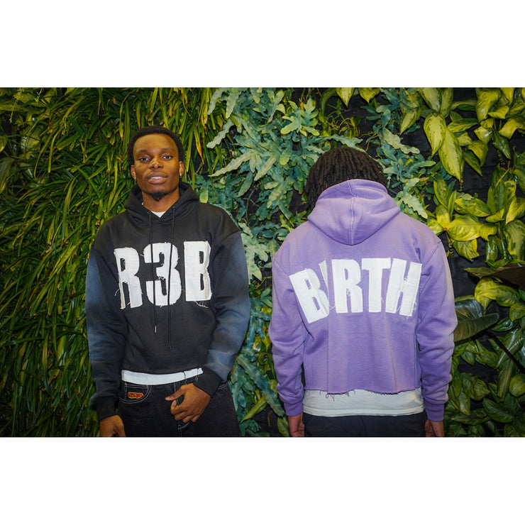 Four people wearing crop hoodies with a design that shows "R3B" and on back "BIRTH"